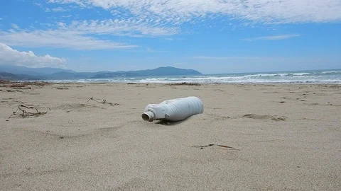 Pick up plastic pieces found on the beach to help environment 4609 Stock Footage 107950852