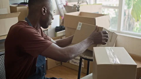 Pick-up Point Manager Using Scanner on Boxes with Parcels Video stock 281717101