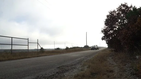 Pick Up Pulling into a Ranch Gate, Towing Hunting Gear Stock Footage 82123865