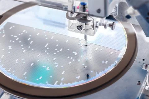 Pick up silicon die  in die attach machine in semiconductor manufacturing, Stock Photos
