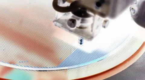 Pick up silicon die  in die attach machine in semiconductor manufacturing, Stock Photos