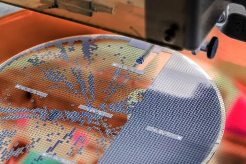 Pick up silicon die  in die attach machine in semiconductor manufacturing, Stock Photos