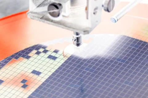 Pick up silicon die in die attach machine in semiconductor manufacturing Stock Photos