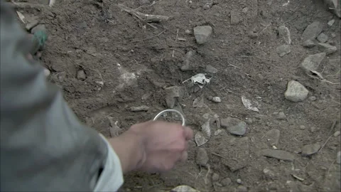 Pick up a silver bracelet Stock Footage 302952664