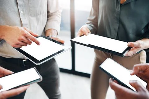 Pick a task and lets go. an unrecognisable group of businesspeople standing Stock Photos