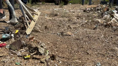 Pick up trash with rake and shovel clean up the world Stock Footage 196924280