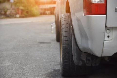 Pick up the wheels from the car in the wrong way,Car on street,car driving on Stock Photos