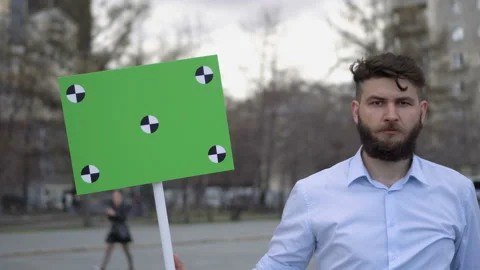 Picket man. The guy is looking at the camera. Banner with points for tracking. Stock Footage 96042815