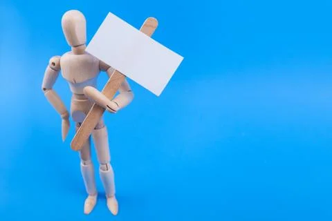 Picket protest sign held by jointed wooden mannequine Stock Photos