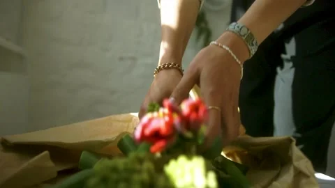 Picking up and placing flowers Stock Footage 164381505