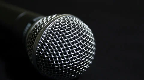 Picking up and setting Microphone down Close Up Video stock 35601828