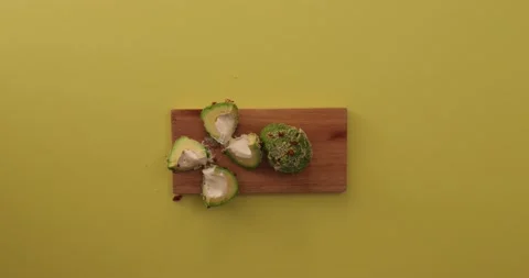 Picking up an avocado and eating it 1 Video stock 132136449