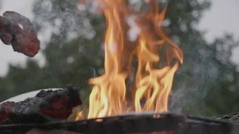 Picking up Bacon From a Grill on an Overcast Day Stock Footage 83241291