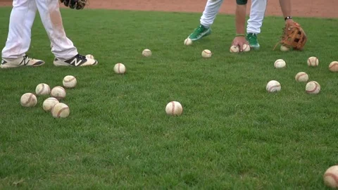 Picking up baseballs slow motion 스톡 동영상 77369893