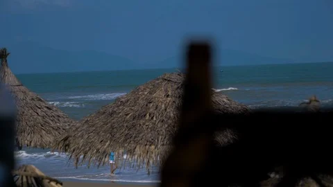 Picking Up A Beer Bottle At A Beach Stock Footage 120332011