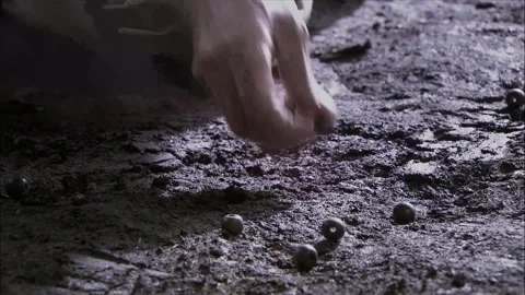 Picking up Buddhist beads scattered on the ground Stock Footage 261632878