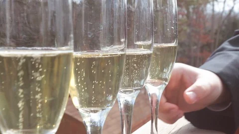 Picking up champagne glass on deck close Stock Footage 103294368