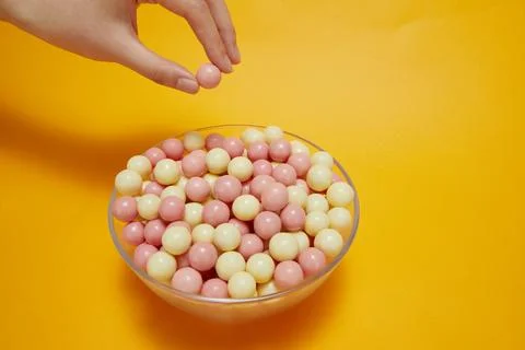 Picking up chocolates Stock Photos