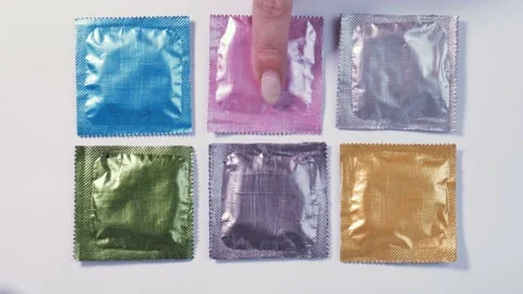 Picking up condom Stock Footage 181067763