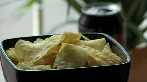 Picking up crisps and a can of drink Stock Footage 11016368