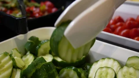 Picking cucumber at salad bar Stock Footage 228024438