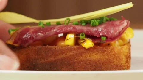 Picking Up Delicious BBQ CORN BREAD WITH CURED WAGYU BEEF, Afternoon Tea, London Stock-Footage 296038732