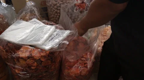 Picking Up Dried Octopus In Pengkalan Kubur Market at Kelantan, Malaysia Stock Footage 34630269