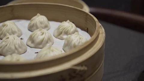 Picking up a dumpling. Close up. Slow motion.  Video stock 78885083
