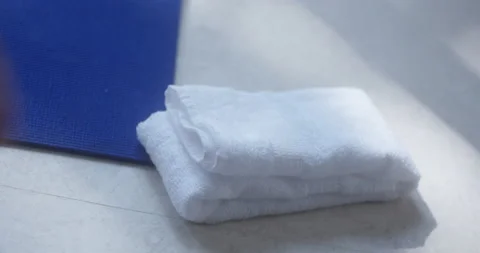 Picking up exercise towel Stock Footage 172109742