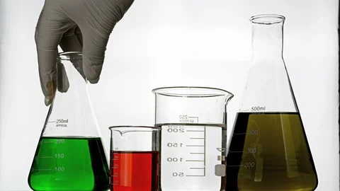 Picking up flask with chemical Stock Footage 99747142