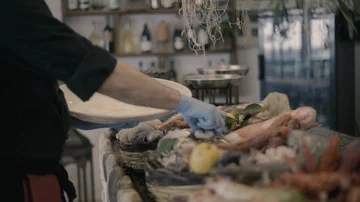 Picking fresh fish from the counter Stock Footage 86076126