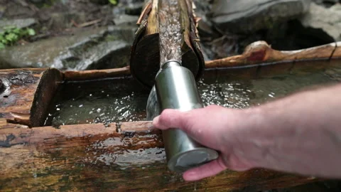 Picking up garbage water plastic nature. Volunteer cleaning river trash Stock Footage 249377564