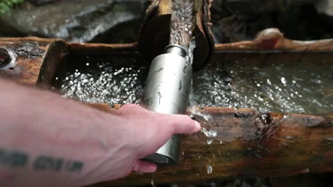Picking up garbage water plastic nature. Volunteer cleaning river trash Stock Footage 249377648