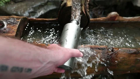 Picking up garbage water plastic nature. Volunteer cleaning river trash Stock Footage 249377655
