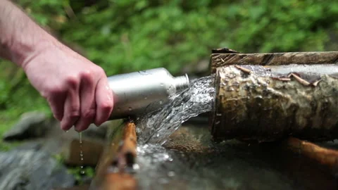 Picking up garbage water plastic nature. Volunteer cleaning river trash Stock Footage 249377729