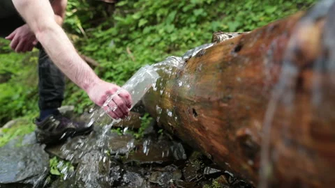 Picking up garbage water plastic nature. Volunteer cleaning river trash Stock Footage 249377973