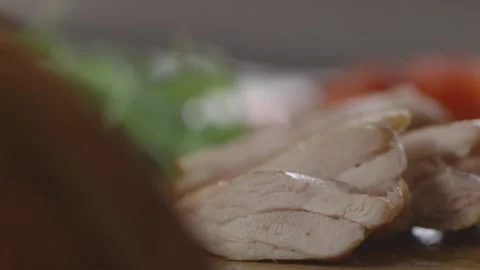 Picking up grilled chicken Stock Footage 194478499