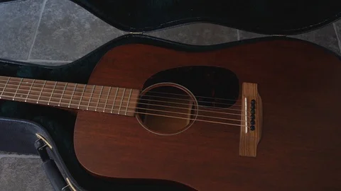 Picking guitar up from case - 4k 60 fps Video stock 112606163
