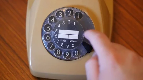Picking up handset and dialing numbers Stock Footage 88256807