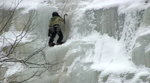 Picking her way up the ice Stock Footage 49647836