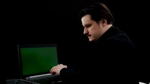 Picking up his phone only to realize that he picked up the wrong one Stock Footage 76153428
