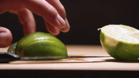 Picking up limes in slow motion Stock Footage 83862802