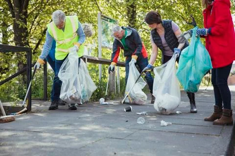 Picking Up Litter Together Fotos Stock
