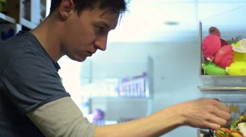 Picking Multiple Items from a Perspex Shelf Stock Footage 62681327