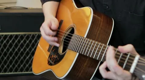 Picking notes on the guitar Stock Footage 21943337