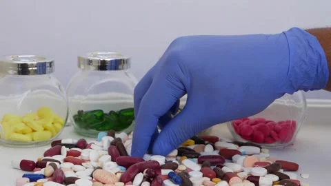 Picking up one tablet from bunch of tablets Stock-Footage 147699757