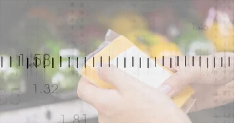 Picking up package, shopper rotating and inspecting white label, comparing with Stock Footage 321377682