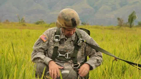 Picking up Parachute after Para Drop (HD)m Stock Footage 11455509