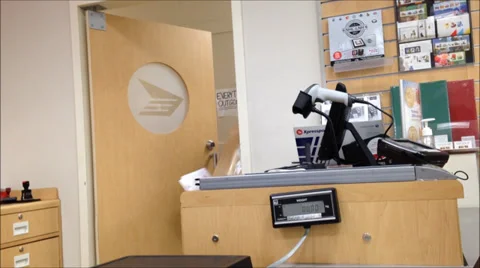 Picking up parcel at post office Stock Footage 38486477