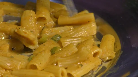 Picking pasta with fork Stock Footage 128198911